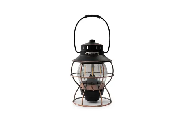 Bronze Barebones Railroad lantern with its carrying handle upright.