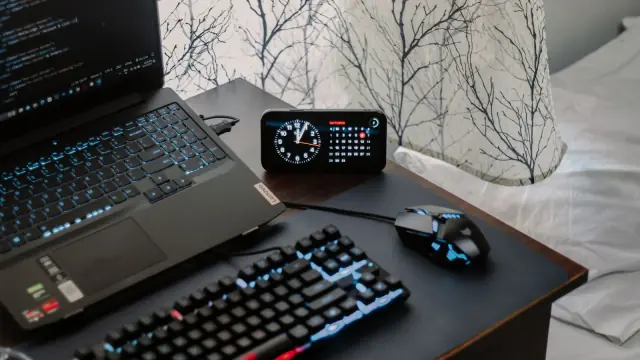 Laptop and peripherals on a desk; contextual photo, not a compared UPS.